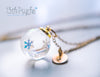Handmade Winter inspired snowflake resin ball necklace - 13th Psyche