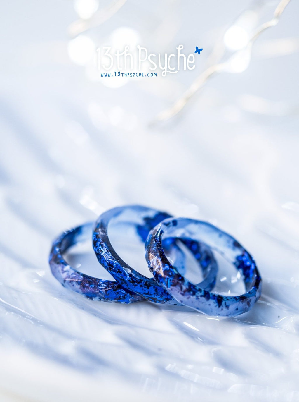 Handmade Light blue faceted resin ring with blue flakes - 13th Psyche