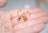 Handmade Hypoallergenic gold hoop earrings with snowflake charm - 13th Psyche